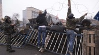 Pro-Russian protesters set a barbed wire on a barricade outside the SBU state security service in Luhansk, in eastern Ukraine